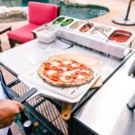 Lifestyle-Ooni-Perforated-Pizza-Peel-Serving.jpg