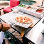 Lifestyle-Ooni-Perforated-Pizza-Peel-Serving1.jpg